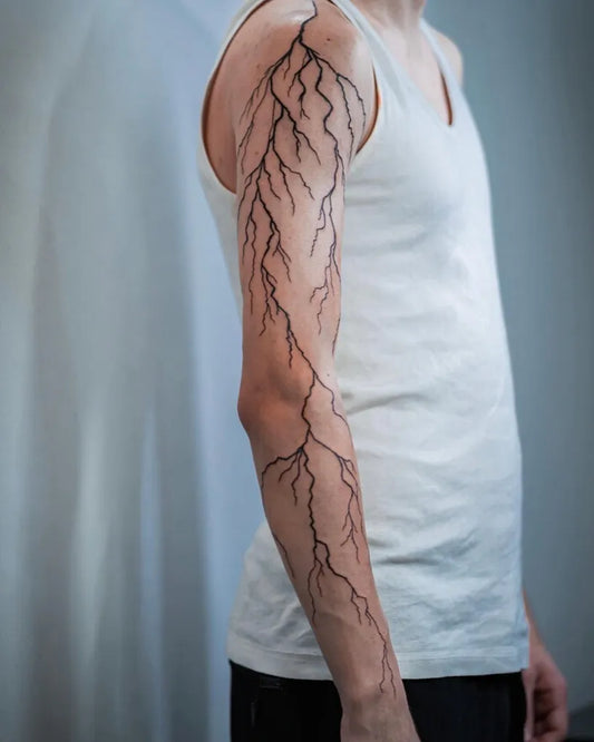 Big Blackwork Lightning Tattoo on Men Arm by @choco.tattoo.downtown