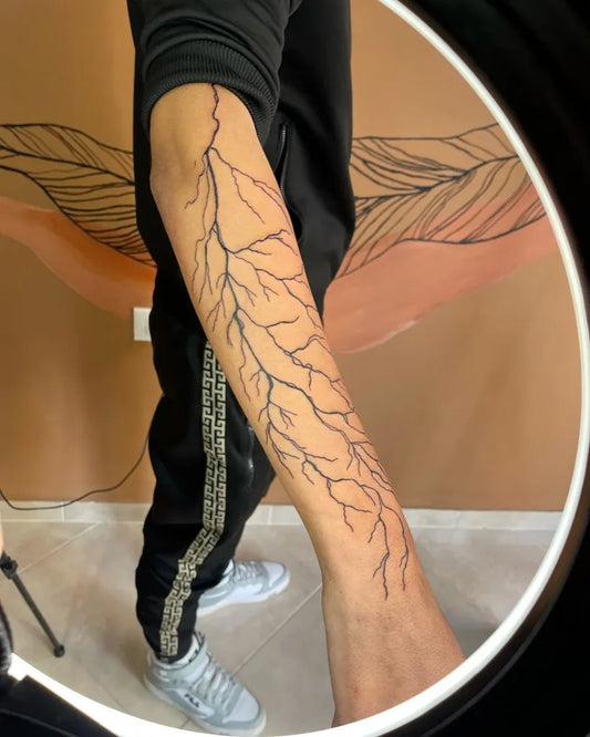 Big Blackwork Lightning Tattoo on Men Arm by @gisela_artstudio