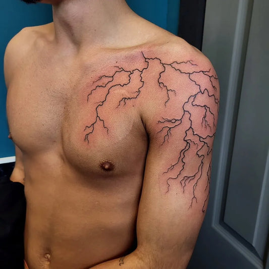 Big Blackwork Lightning Tattoo on Men Shoulder by @gingersnapped.tatts
