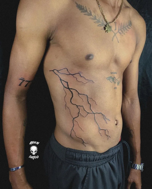 Big Blackwork Lightning Tattoo on Men Side by @alienn__tattoo