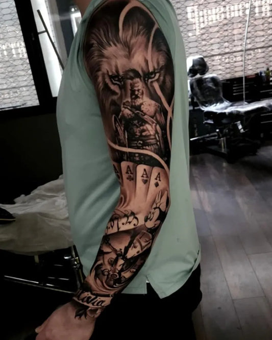 Big Blackwork Lion Warrior Cards on Men Arm Sleeve Tattoo by @hrtattoostudioglasgow