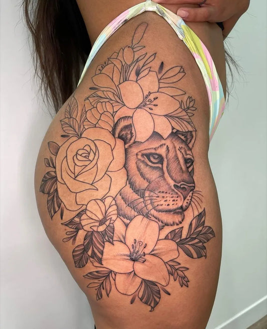 Big Blackwork Lion and Flowers Tattoo on Women Hip by @jonelrjavinal