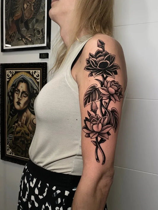 Big Blackwork Lotus Flower and Leaves on Women Shoulder Tattoo by @ufo_kreations_tattoo