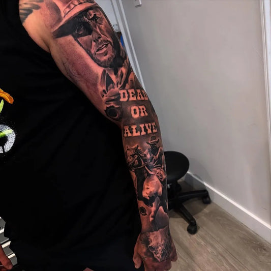 Big Blackwork Man in hat with dead or alive text on Men Arm Tattoo by @jacksteere_tattoos_
