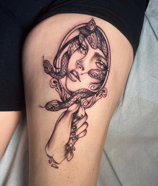 Big Blackwork Medusa Mirror with Snakes on Women Thigh Tattoo by @lucky.lady.tattoo