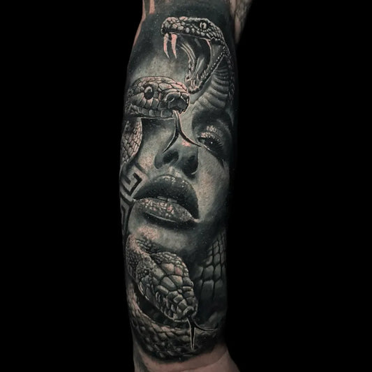 Big Blackwork Medusa Snakes Face on Women Arm Tattoo by @revivaltattoostudio