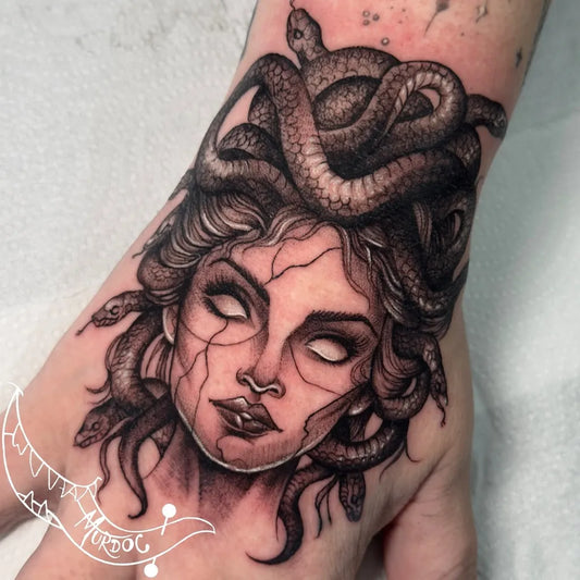 Big Blackwork Medusa Snakes on Women Hand Tattoo by @murdoctattooepiercing