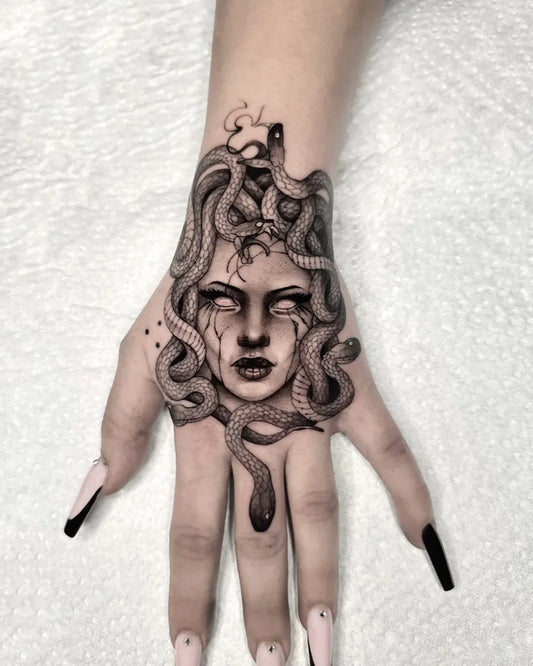 Big Blackwork Medusa Snakes on Women Hand Tattoo by @rik.ds_tattoo