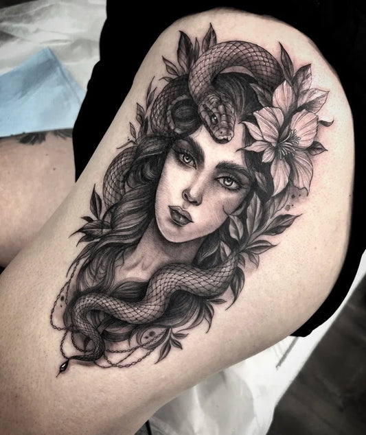 Big Blackwork Medusa with Snake and Flowers on Women Thigh Tattoo by @whitefeatherink
