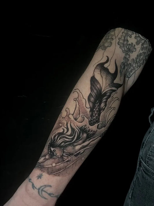 Big Blackwork Mermaid Waves Tattoo on Women Arm by @el.perro_tattoo