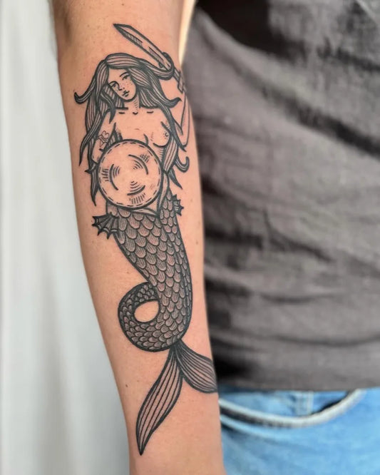 Big Blackwork Mermaid with Sword and Shield Tattoo on Women Arm by @pelc.tt