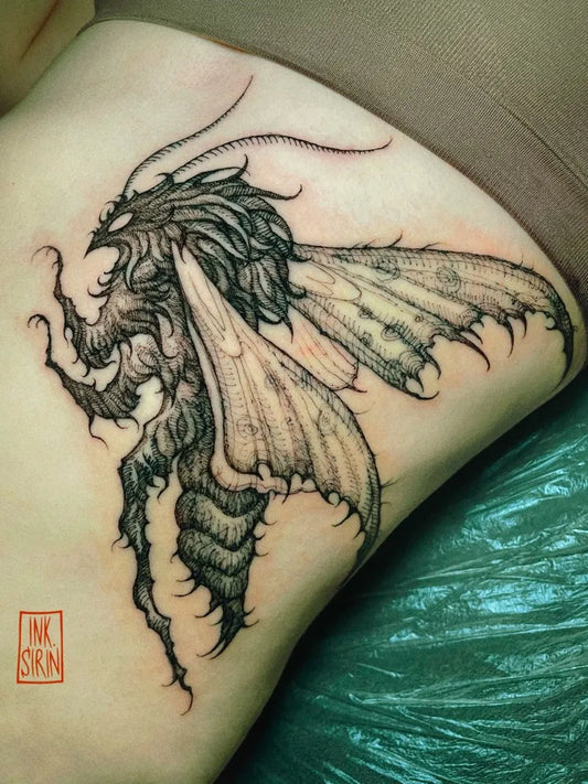 Big Blackwork Moth Tattoo on Women Rib by @ink.sirin