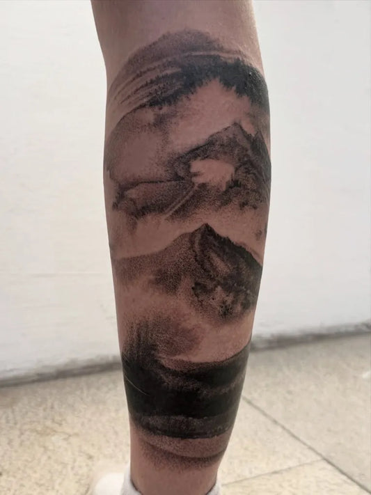 Big Blackwork Mountain and Mist Tattoo on Women Leg by @agnes.tattoo