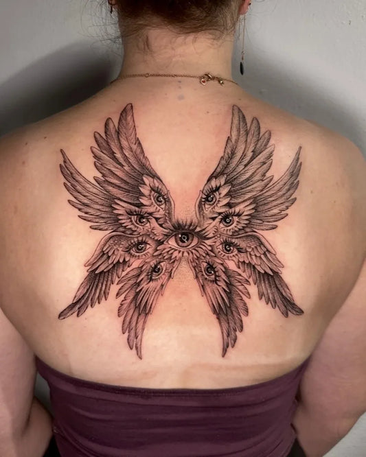 Big Blackwork Multi Eyed Angel Wings on Women Back Tattoo by @hazellainee