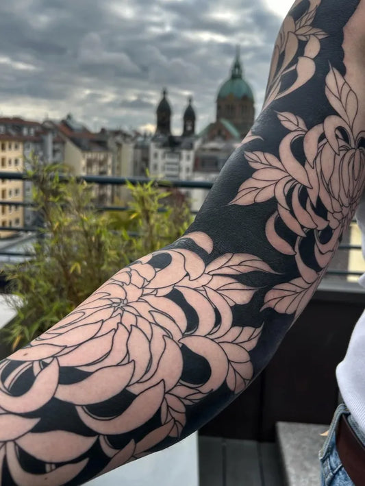 Big Blackwork Negative Space Chrysanthemum Sleeve Tattoo on Men Arm by @danidtattooer