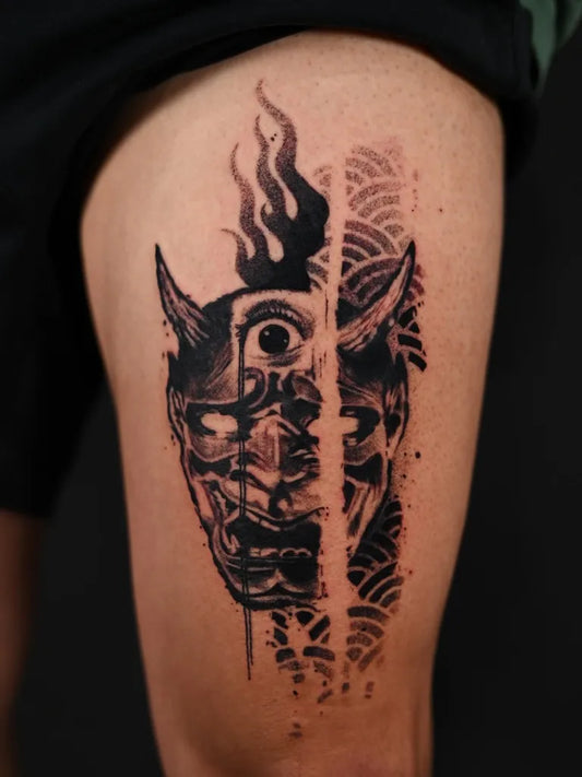 Big Blackwork Oni Mask with Flames and Waves on Men Thigh Tattoo by @bradleysilvertattoo