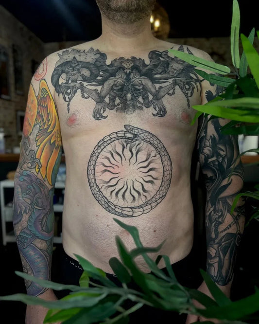 Big Blackwork Ouroboros Sun Tattoo on Men Chest by @yv5mine