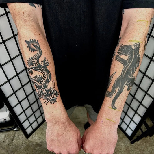 Big Blackwork Panther and Dragon Tattoo on Men Arms by @micky_macleod