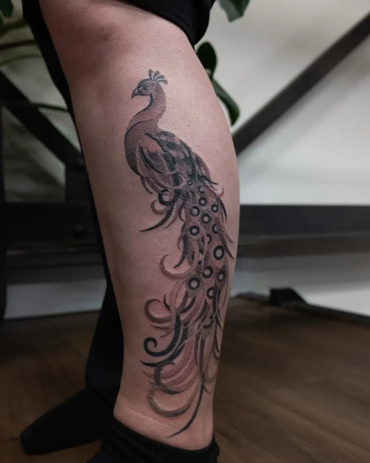 Big Blackwork Peacock Tattoo on Women Leg by @scorpiopokes
