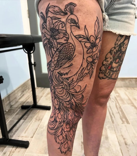 Big Blackwork Peacock and Lilies Tattoo on Women Thigh by @ecwtattoo