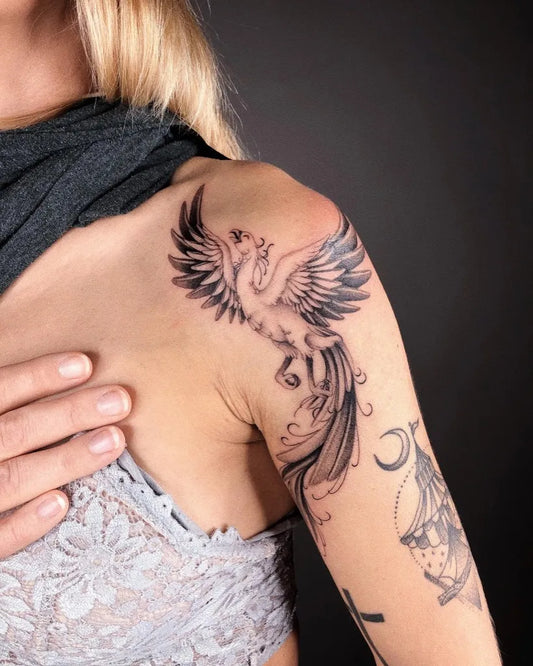 Big Blackwork Phoenix Crescent on Women Shoulder Tattoo by @anngravure