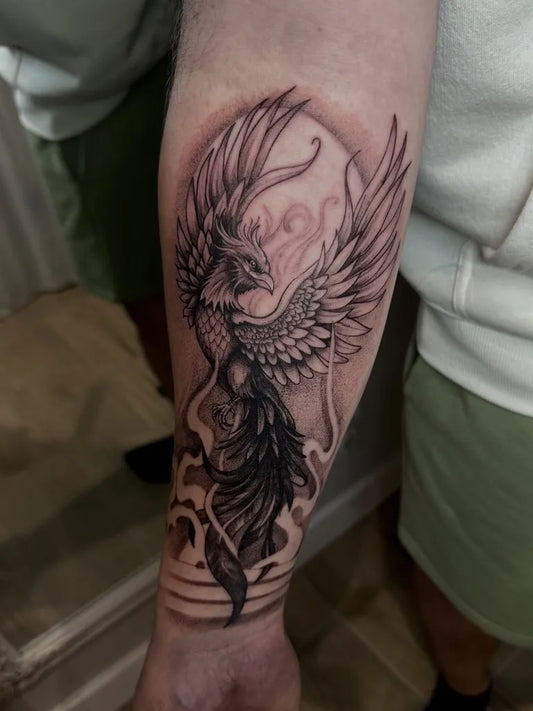 Big Blackwork Phoenix on Men Arm Tattoo by @ethereal.inkstudios