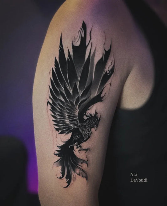 Big Blackwork Phoenix on Men Shoulder Tattoo by @ali.davoudi_tattoo