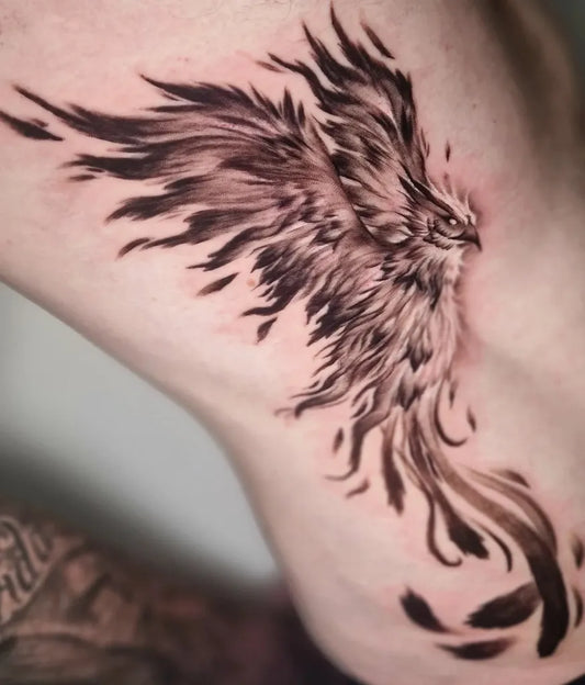 Big Blackwork Phoenix on Women Rib Tattoo by @jadelouisetattoos