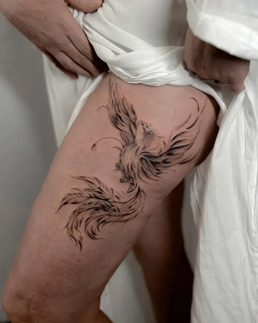 Big Blackwork Phoenix on Women Thigh Tattoo by @tattoo_art_elisa