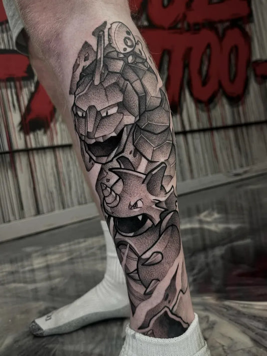 Big Blackwork Pokemon Totodile and Armor Tattoo on Men Leg by @deafkidink