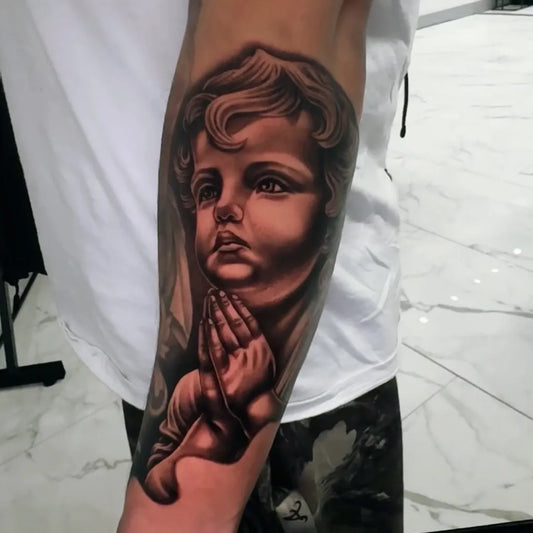 Big Blackwork Praying Angel on Men Arm Religious Tattoo by @reveal_david