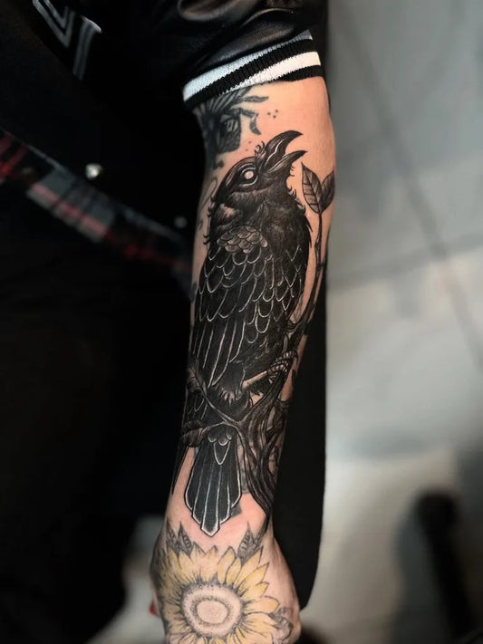 Big Blackwork Raven and Flowers on Men Arm Tattoo by @inkorporation_tattoo