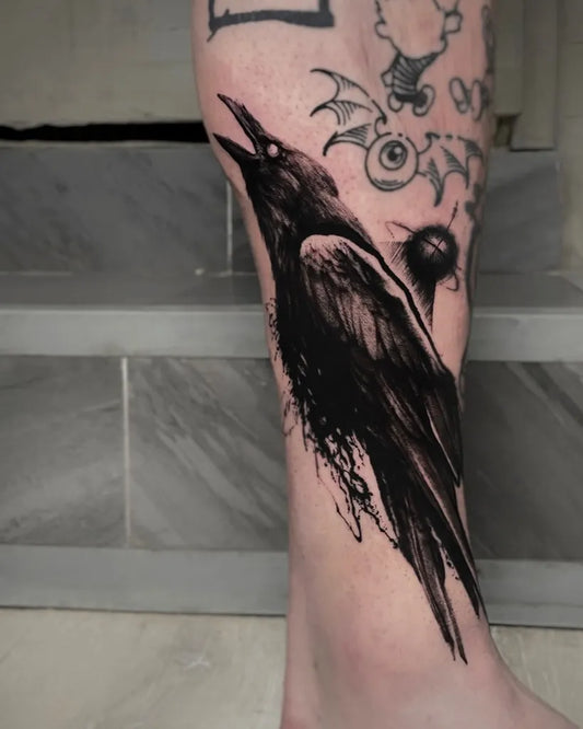 Big Blackwork Raven with Wings and Eyes on Men Leg Tattoo by @marco.odio