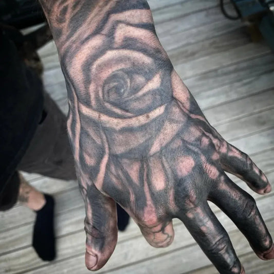 Big Blackwork Rose on Men Hand Tattoo by @hurtsbyhertz