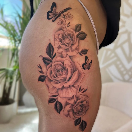 Big Blackwork Roses and Butterflies on Women Thigh Tattoo by @pepr.ink