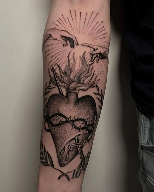 Big Blackwork Sacred Heart with Flames and Laurel Wreath Tattoo on Men Arm by @steva.tattooer