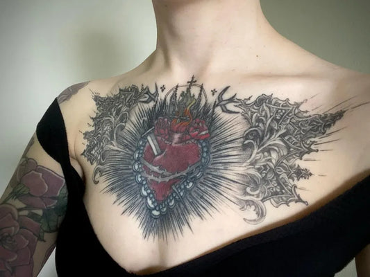 Big Blackwork Sacred Heart with Floral Wings Tattoo on Women Chest by @kyliejames_tattoo