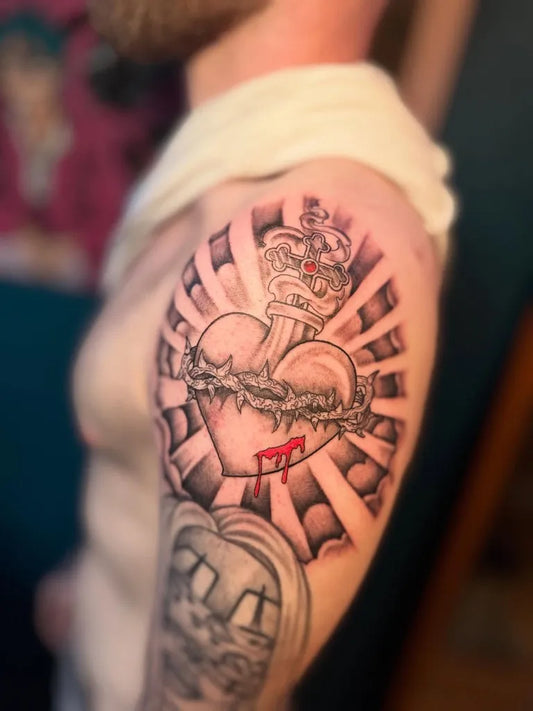 Big Blackwork Sacred Heart with Rays and Crown Tattoo on Men Shoulder by @inkvandan_tatz