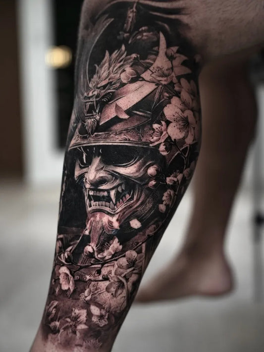 Big Blackwork Samurai Hannya Mask and Cherry Blossoms Tattoo on Men Leg by @leonjaycolley