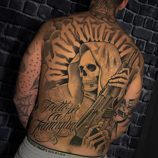 Big Blackwork Santa Muerte with Gun and Script Tattoo on Men Back by @ryan.ryan_street.creed