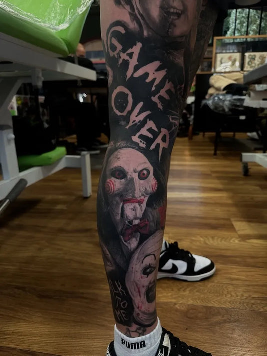 Big Blackwork Saw Horror Tattoo on Men Leg by @domdurrelltattoo