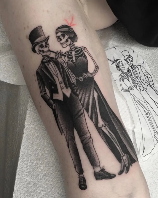 Big Blackwork Skeleton Couple Tattoo on Women Arm by @lifestooshort.tattoo