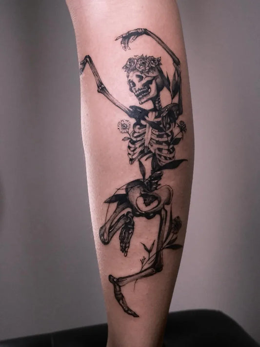 Big Blackwork Skeleton Dance with Flowers Tattoo on Women Leg by @atelier.piart