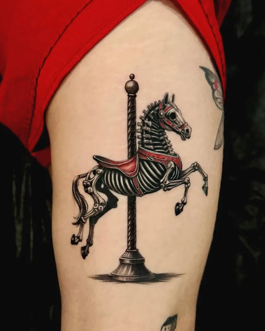 Big Blackwork Skeleton Horse Carousel on Women Thigh Tattoo by @tattoosfolder