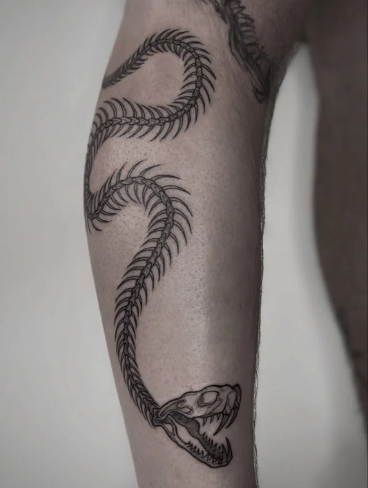 Big Blackwork Skeleton Snake on Men Leg Tattoo by @u.oli.nie.boli