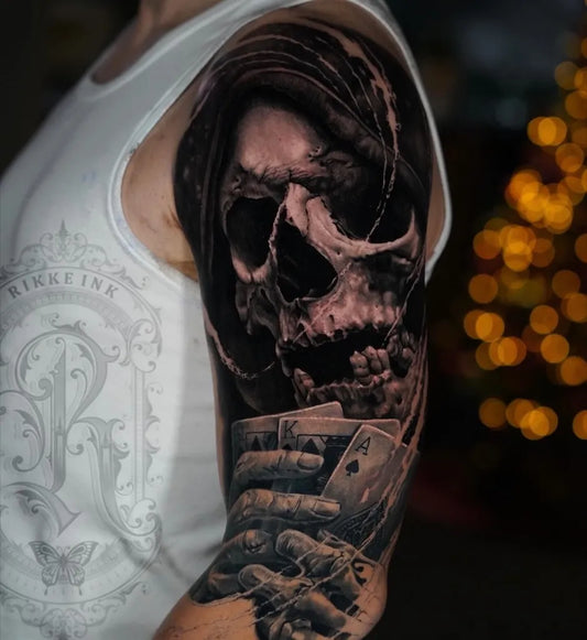 Big Blackwork Skull Cards on Men Arm Tattoo by @rikke_ink