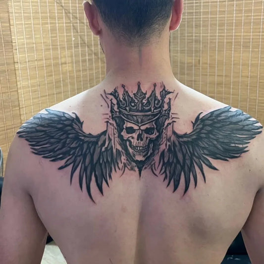 Big Blackwork Skull Crown Wings on Men Back Tattoo by @zikotattoo