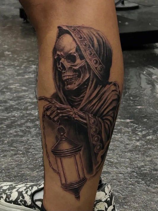 Big Blackwork Skull Hooded Figure Lantern on Men Leg Tattoo by @cginks