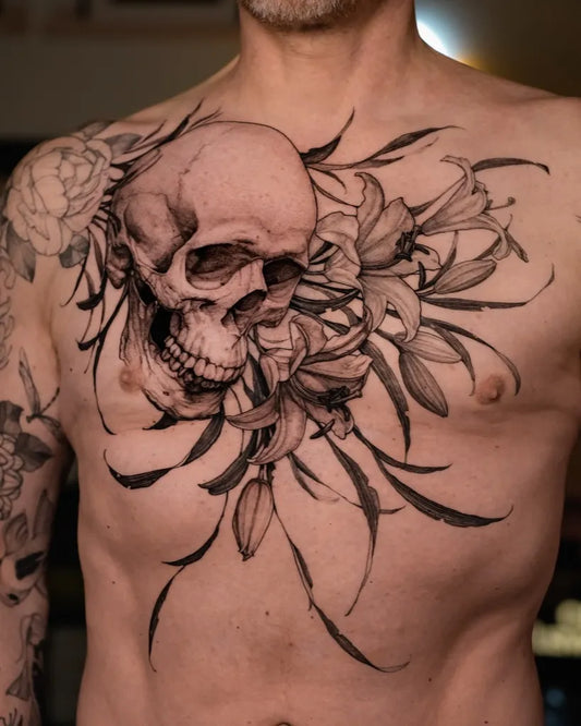 Big Blackwork Skull Lilies on Men Chest Tattoo by @lama_del_ray