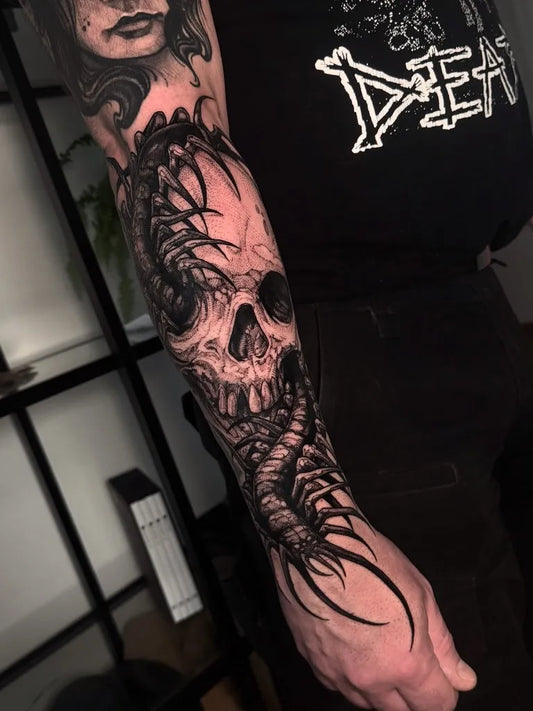 Big Blackwork Skull and Snake on Men Arm Tattoo by @sootskin